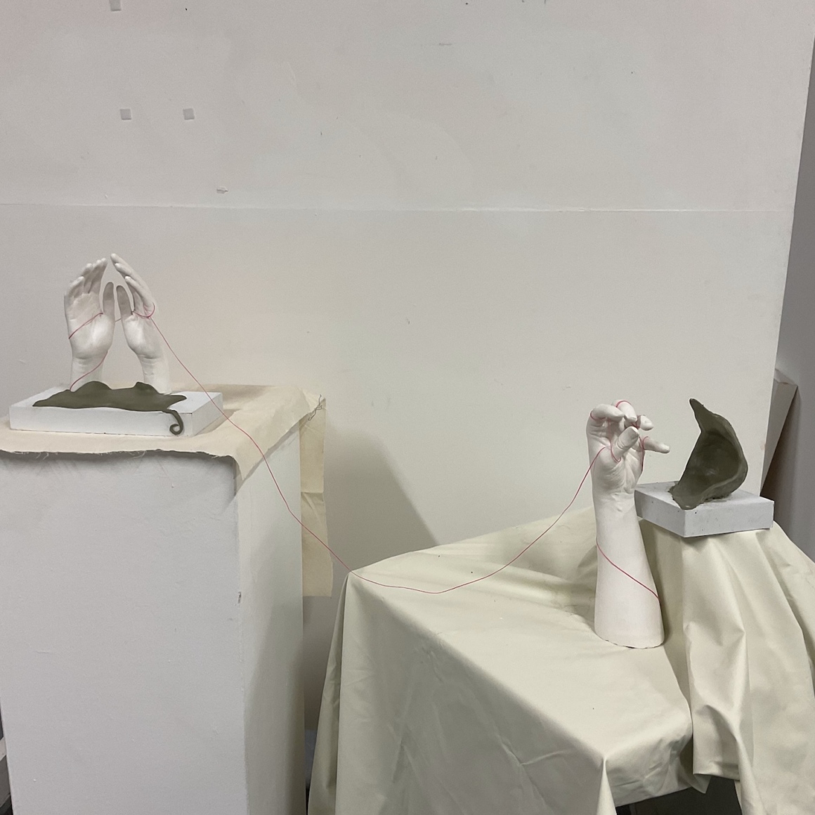 Fatoumata Gandega, FROM LAND TO SEA, 2025
Life Casting Hand, (Crystacal White Plaster), Green Chevant NSP Clay Medium, Wax Thread Pink.