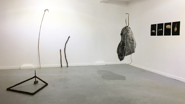 Gail Mahon, Untethered, Thameside Studio Gallery, London, 2019 Collaboration work with Kim Norton, within group show- In Search of The Vernacular- curated by HAPTIC /TACIT London Thameside Studios Gallery. Constructed ceramic pole structures, latex wall cast, raw clay and ceramic objects, photography on bamboo paper, (Gail) Canvas canopy, raw clays (from Carmarthen, Oxford, Northern Ireland), oxide, muslin, rope, wooden sticks, found stone, brick (Kim).