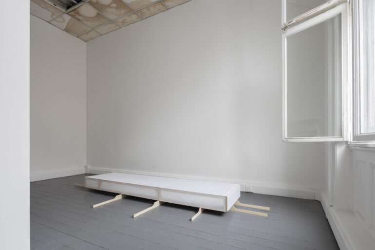 Isabel English, Installation view of what we were or might be at The Annex Dublin (2022). Materials: birch plywood, muslin, cotton, pillowcase, synthetic lining, t-needle, safety pin, foam, polyester. Dimensions: birch supports and vitrine case. Photo Credit: Kate-Bowe O’Brien