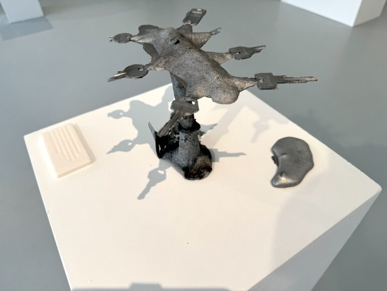 Simon Browne, private keys, sand-cast aluminium, porcelain, 2025