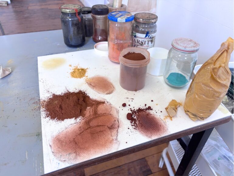 Exploring earth and natural pigments during the residency, in Project Space, LSC, 2026.